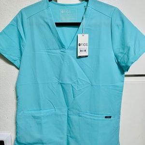 Figs scrub set - new with tags. Size small. Aqua blue color.